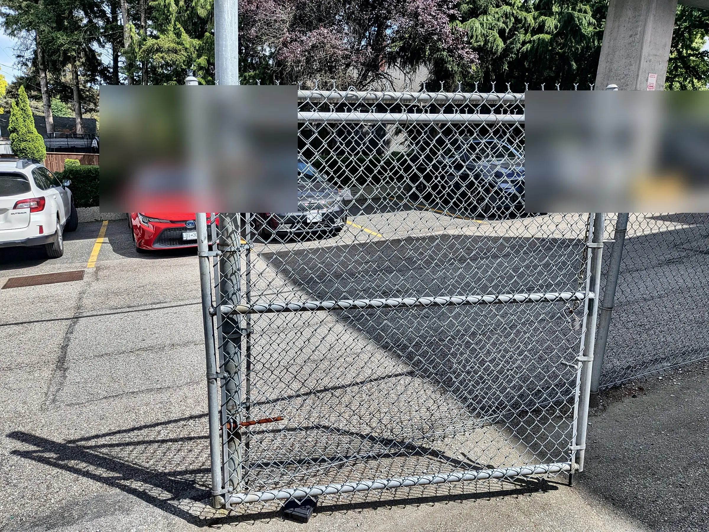The rebuilt chain-link gate, closed