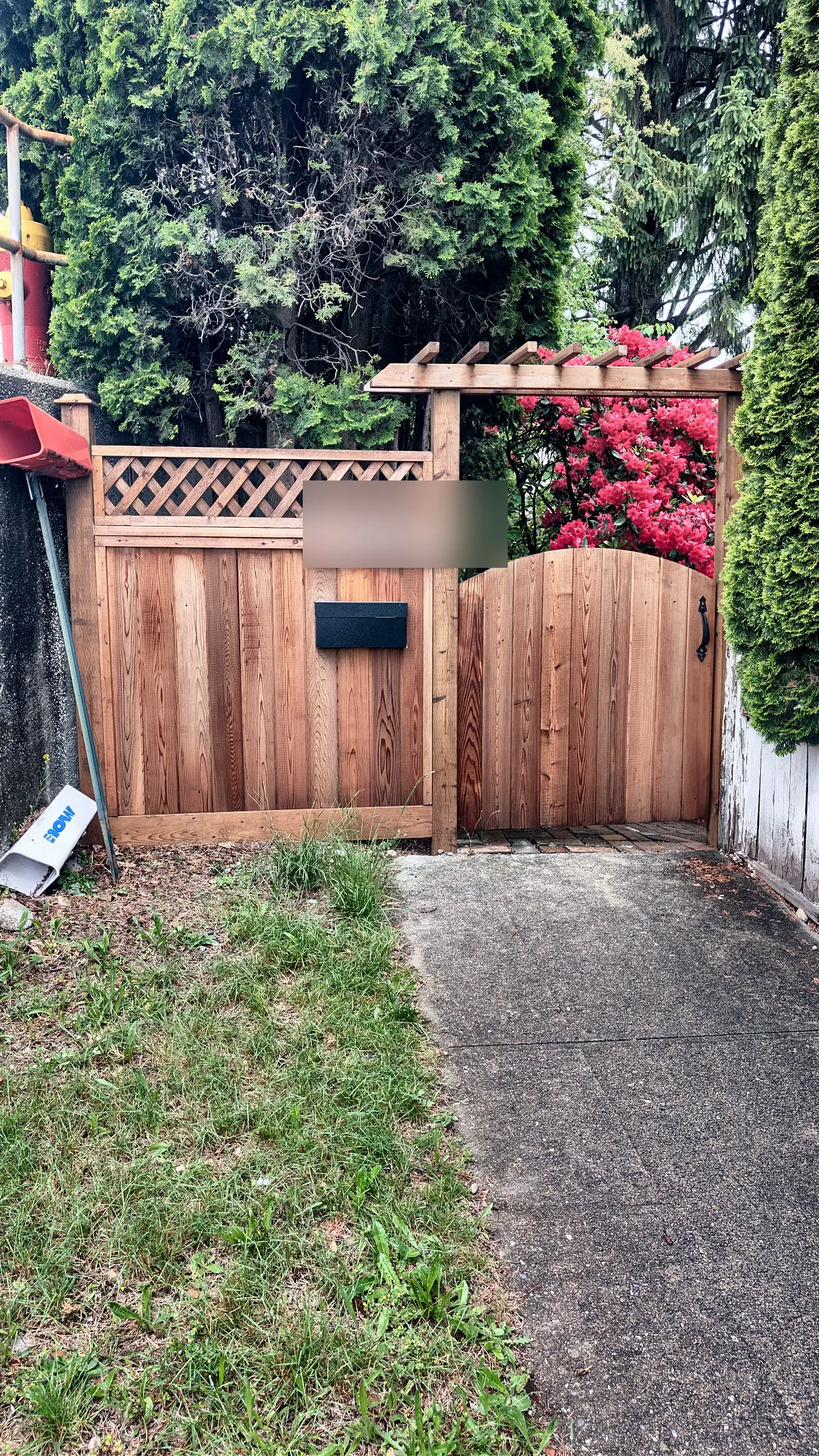 Arched cedar gate and arbor, one year after the build, Coquitlam