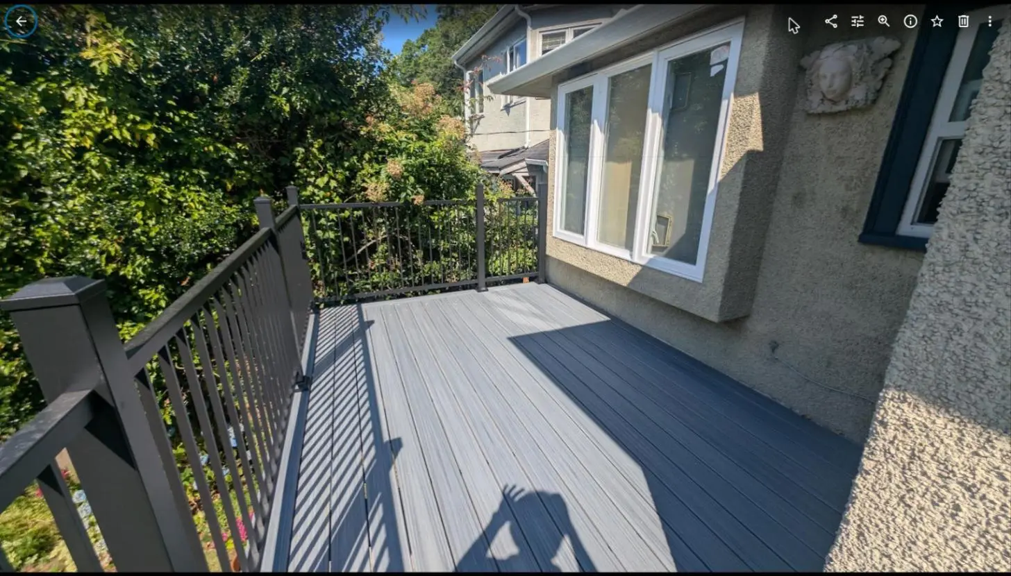 Black aluminum railing at the corner of a composite deck, Dunbar