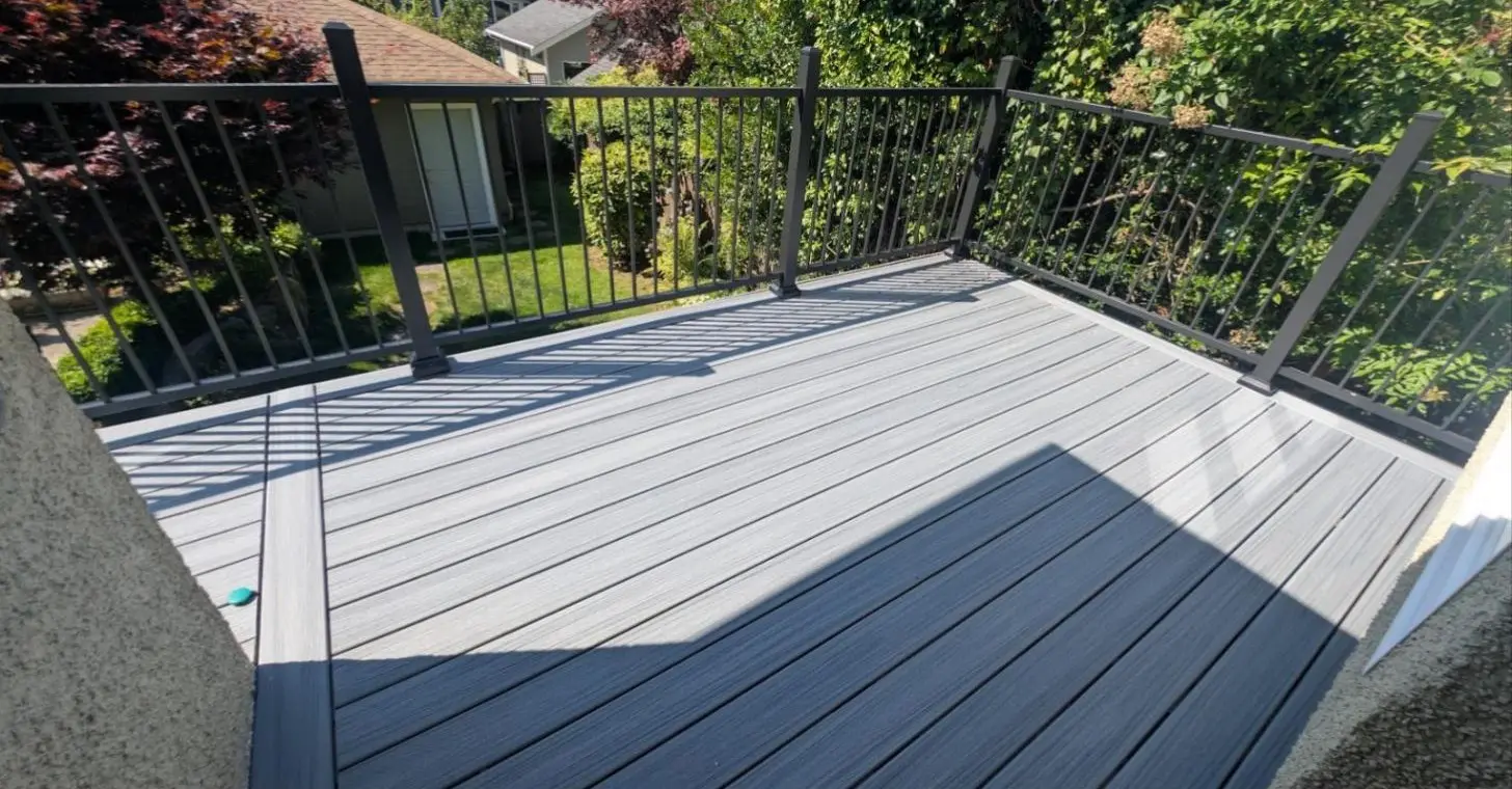 The finished grey composite deck with black aluminum railing, Dunbar