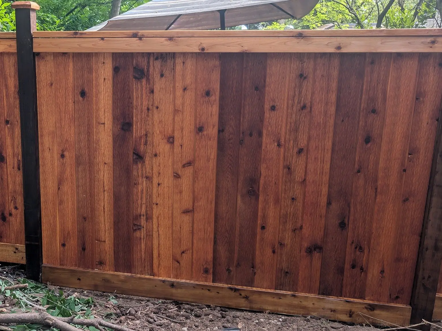 Stained cedar privacy fence we built in Champlain Heights