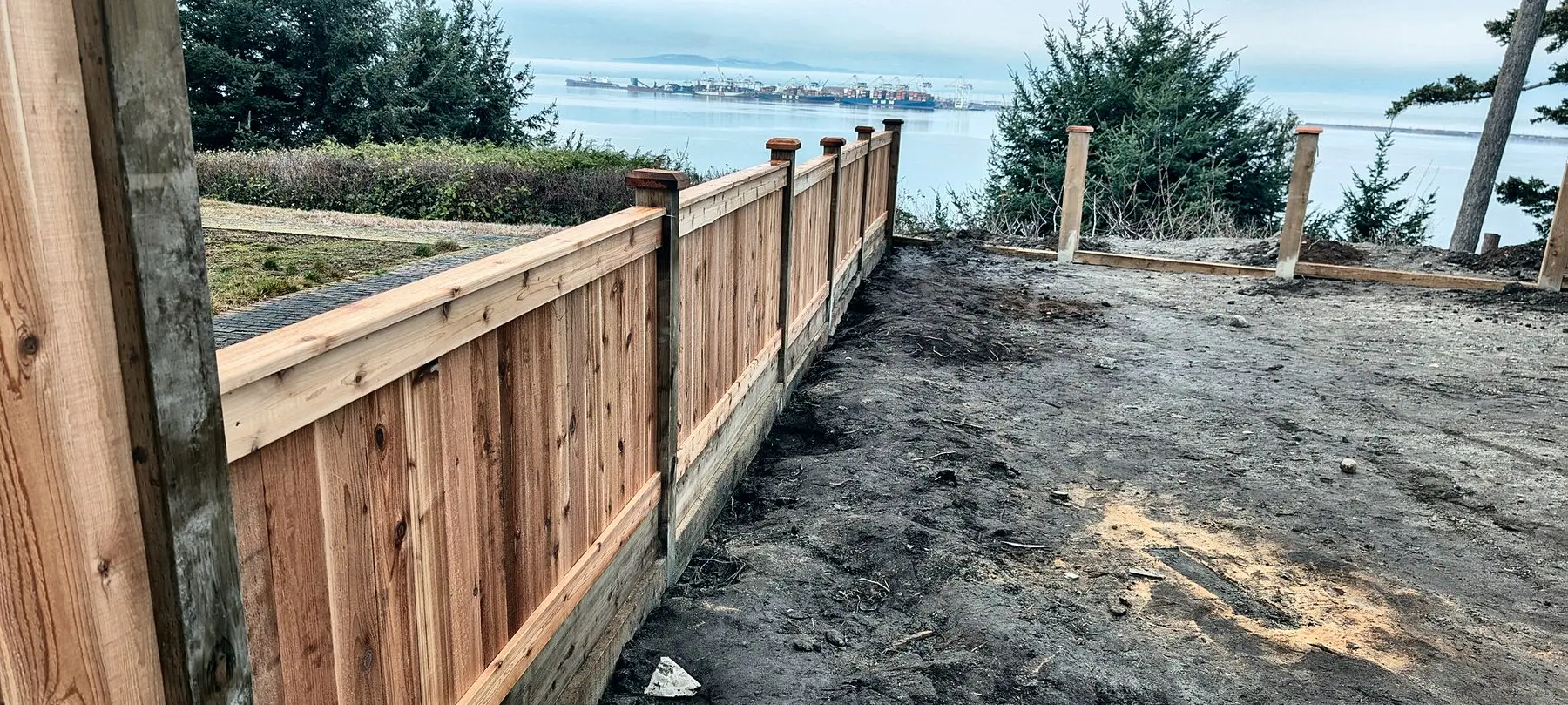 Cedar privacy fence along a waterfront back yard, Ladner