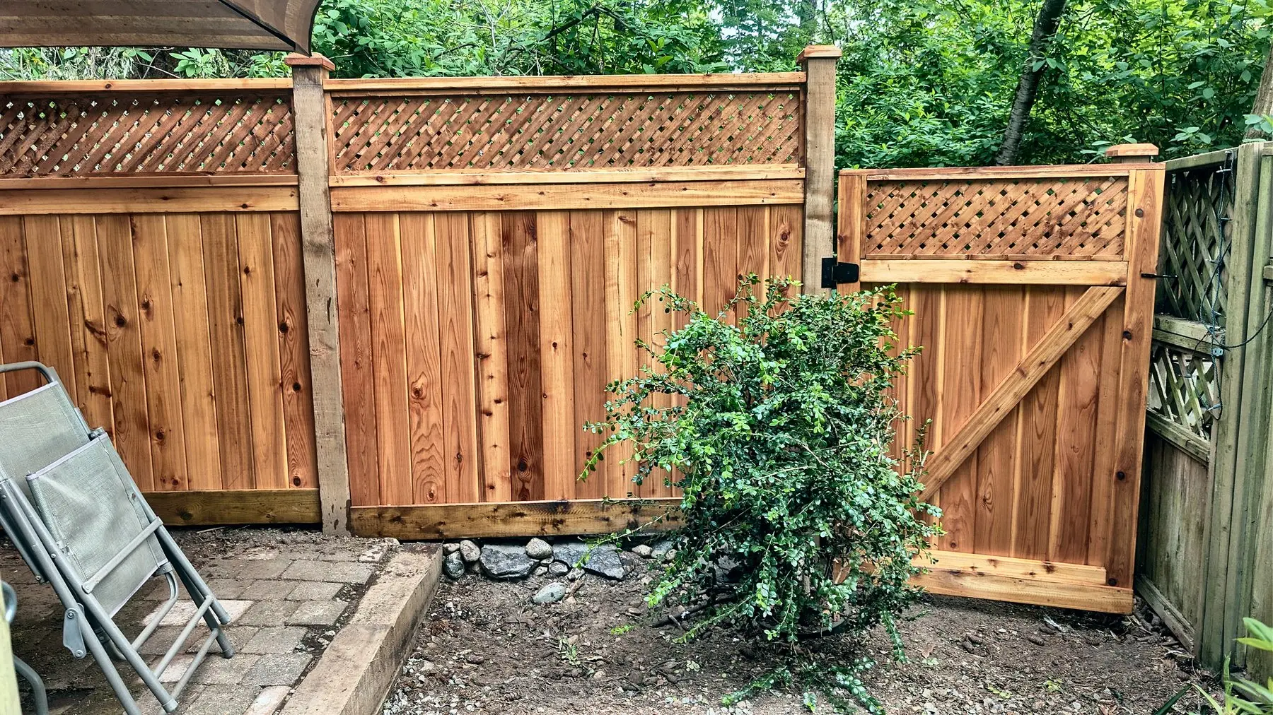 Custom cedar gate in a lattice-top fence, Champlain Heights