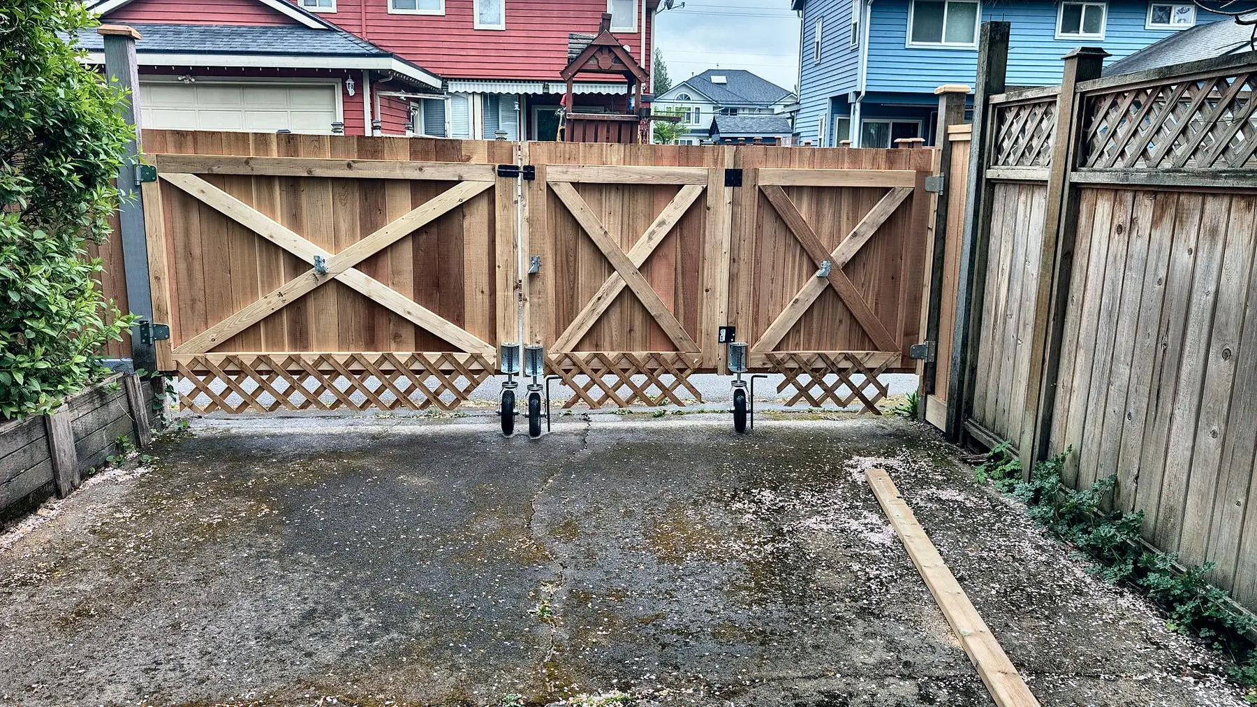 Three-panel cedar driveway gate and privacy fence, Surrey