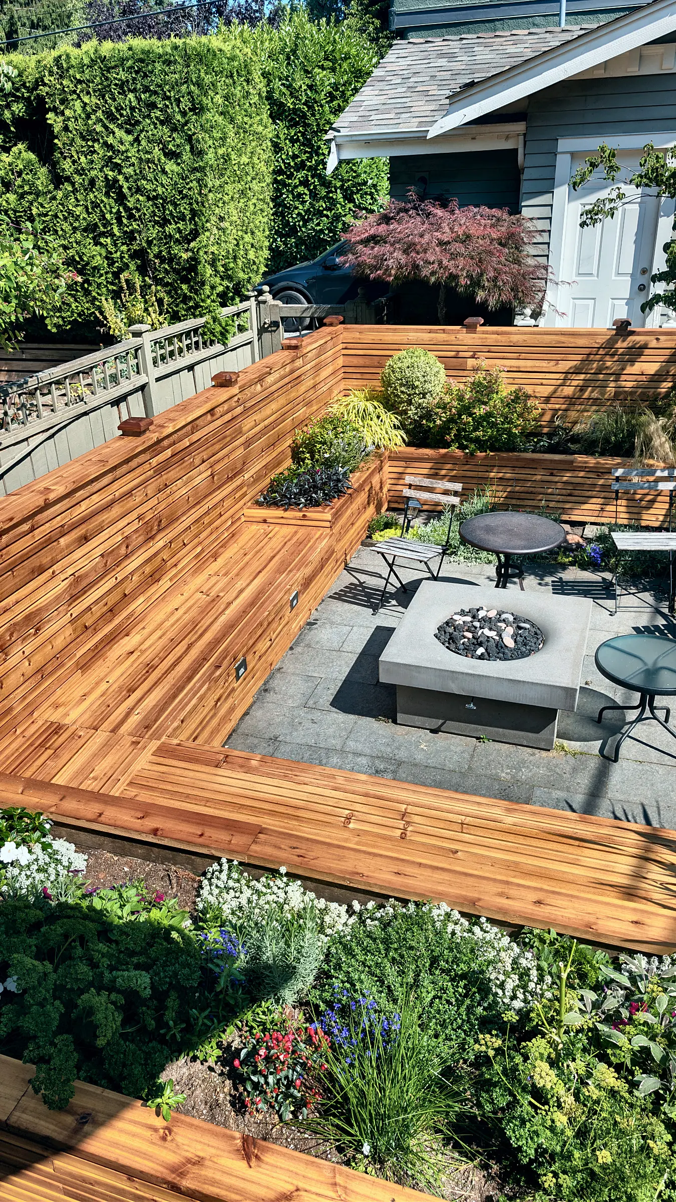 The planters and fire pit from the deck