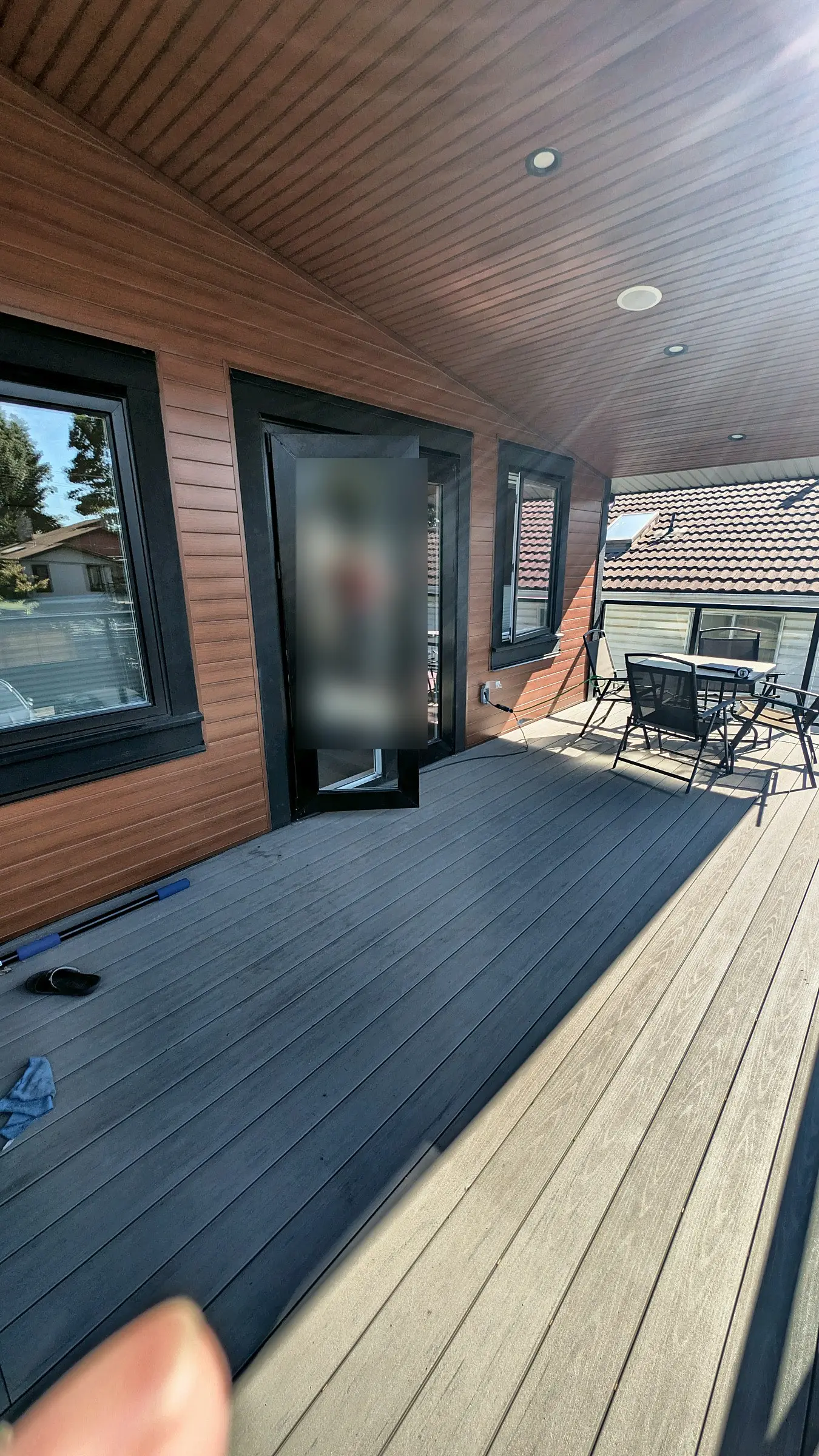 Grey composite boards running to the door, Burnaby