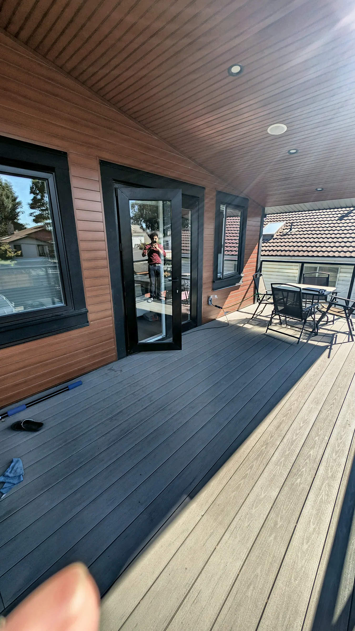 Grey composite boards running to the door